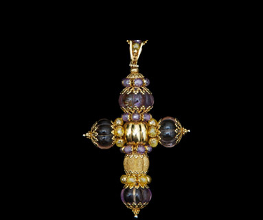 Groved amethyst cabachons using Gold filgree caps Groved amethyst cabachons using Gold filgree caps